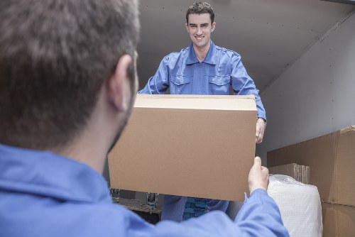 Man with van service assisting a Docklands move with boxes and furniture
