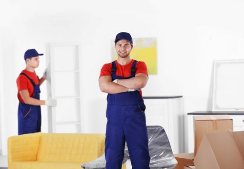 Packed moving boxes and furniture ready for house removals in Docklands
