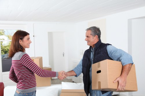 Local removals team handling a move near Docklands buildings